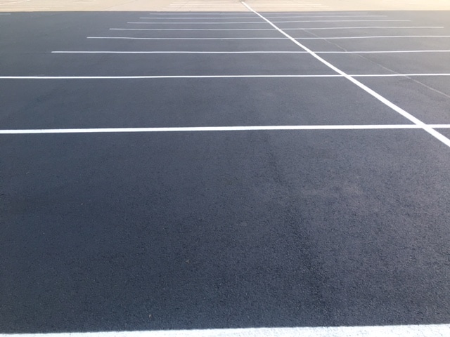 White Stripes On Asphalt Parking Lot