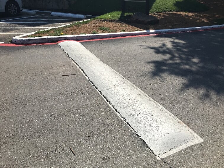 White speed bump in Palmetto Bay, Florida parking lot